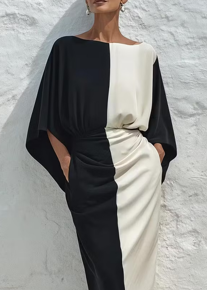 Two-piece set with a contrasting white and black top and midi skirt
